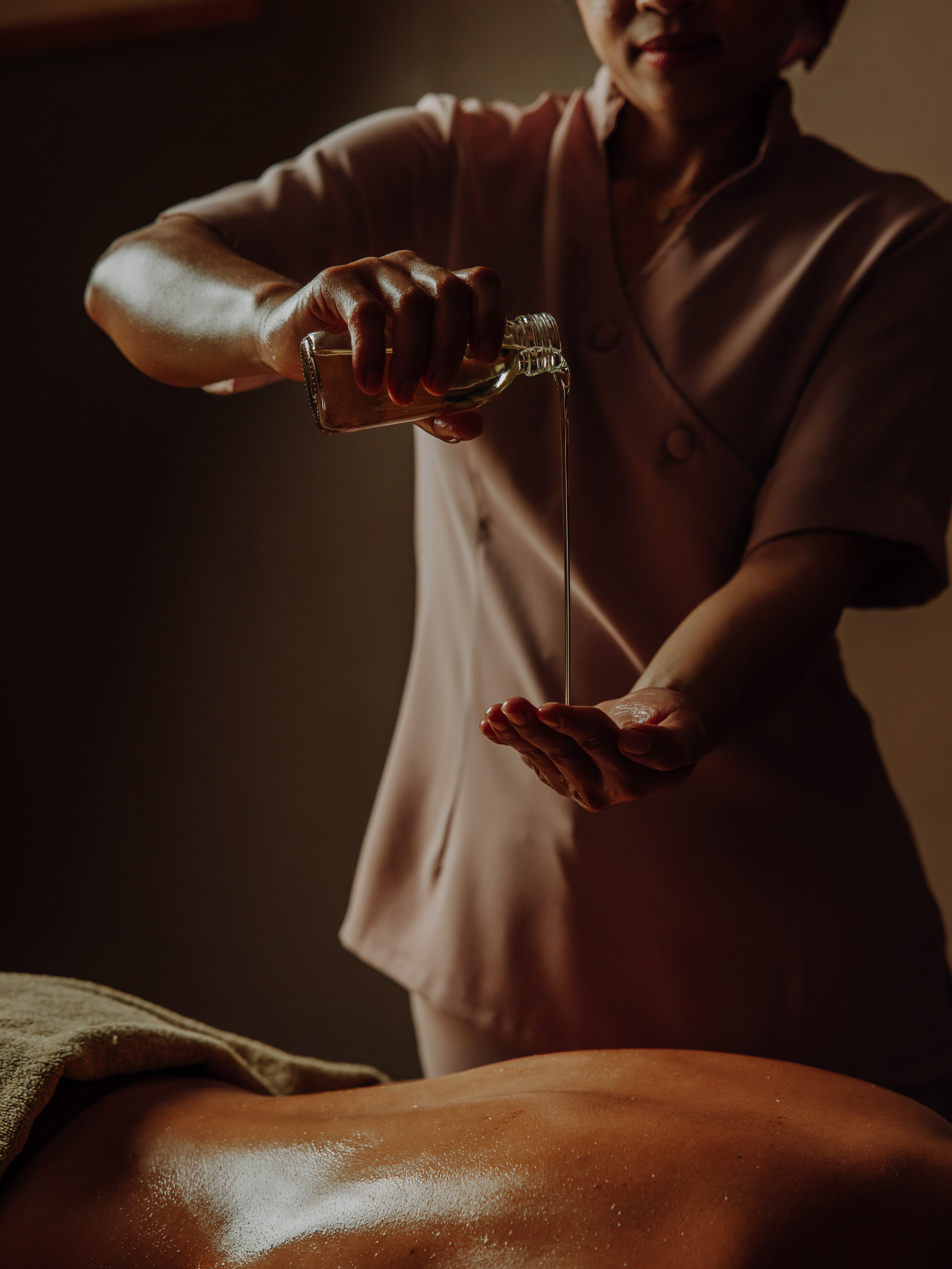 Massage with heated oils on a warmed table